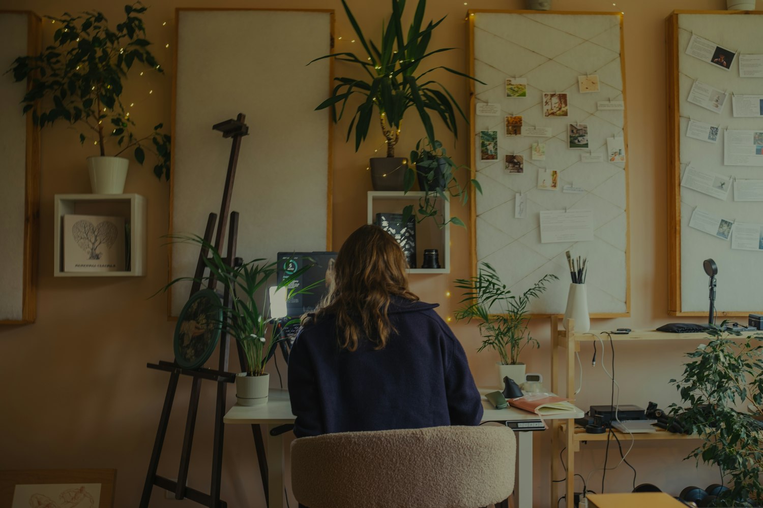 A marketer at a studio desk with mood boards