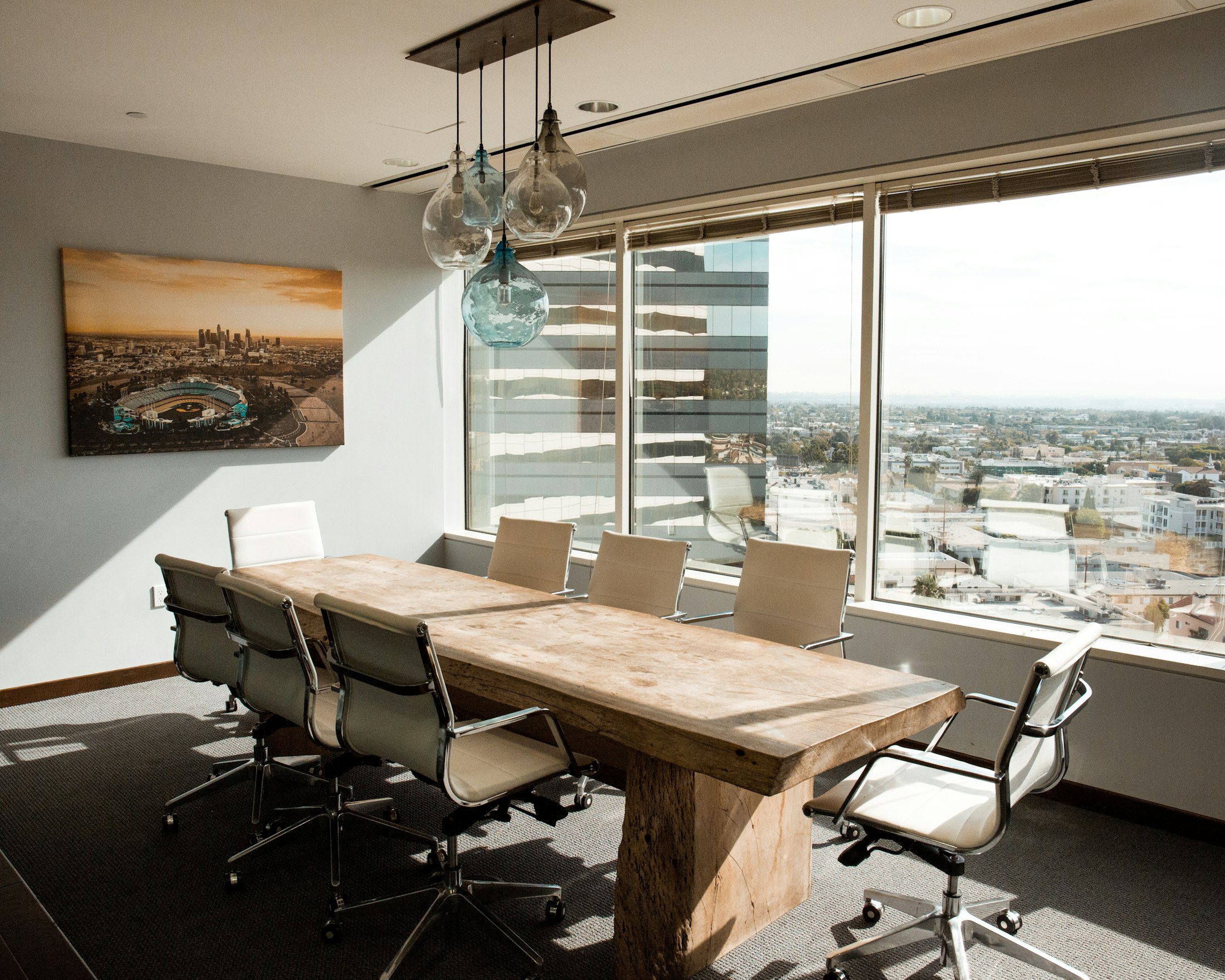 A quiet boardroom with a city view, where the firm's most sensitive conversations happen